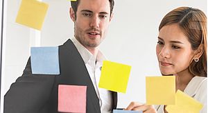 Two persons with post-its