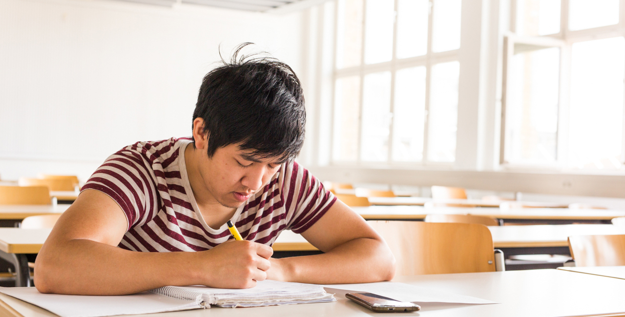 Student taking notes