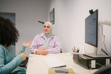 Employee counsels a student