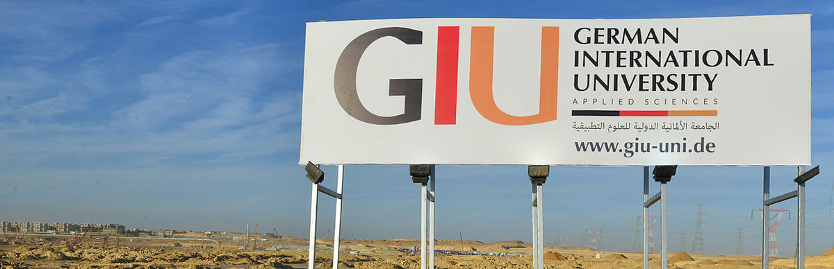 Construction sign on the future GIU campus