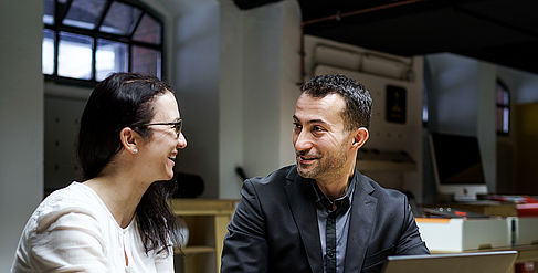 Two employees in conversation